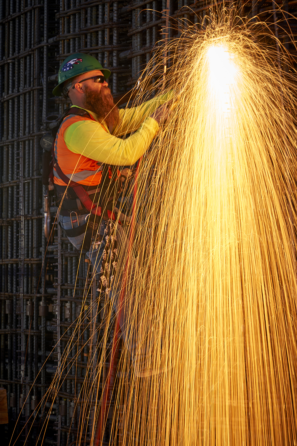 Welder Working on the Construction of The Grand, Bright Orange Sparks